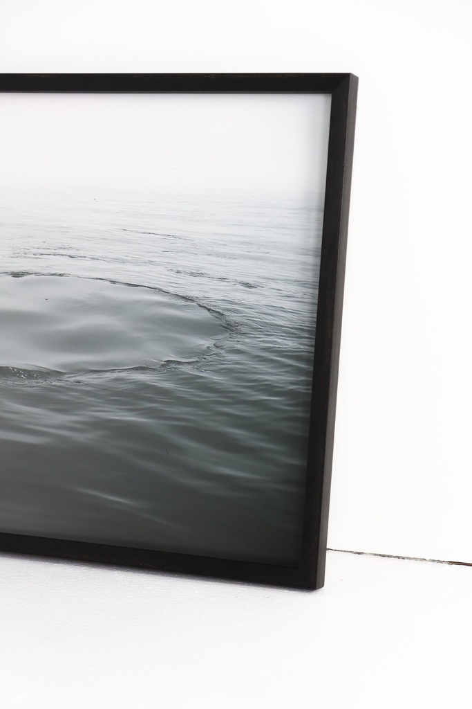 Water ripples framed in black frame — view 2